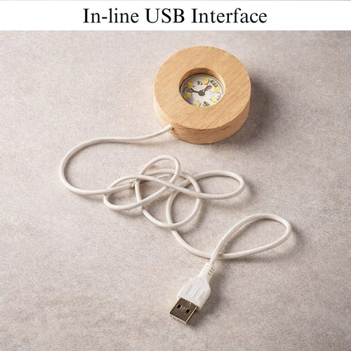 Wooden device with a USB cable on a gray surface